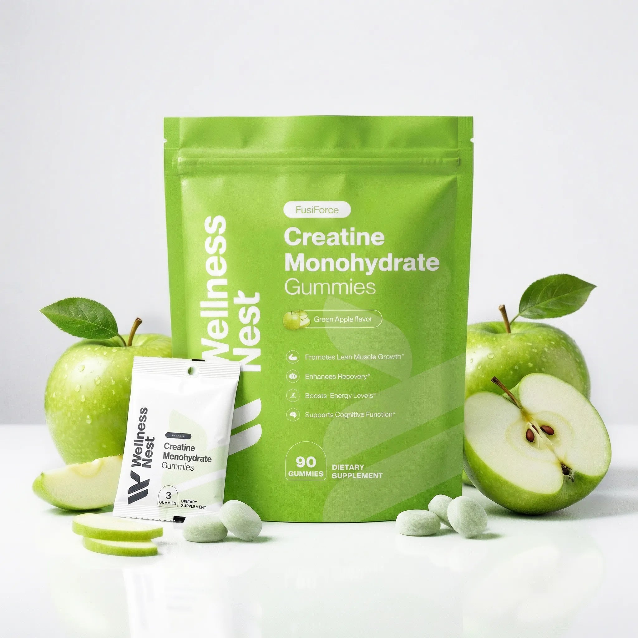 FusiForce creatine monohydrate gummies green apple flavor in a resealable 90-gummy pouch with a 3-gummy sample sachet and fresh green apples